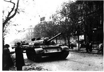 black and white photo of tanks on the street