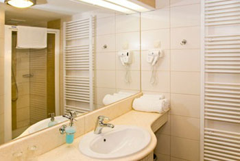 a basin and mirror in the bathroom