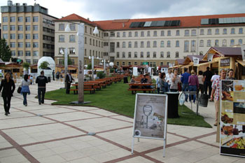 wooden stalls of exhibitors and visitors on the Gourmet Festival in Millenaris Park