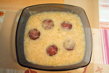 a bowl of Hungarian korhely soup with slices of sausage