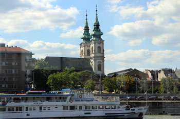 the two towers of St. Anne Church photographed from a boat on the Danube