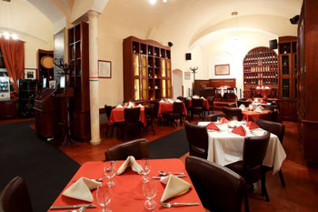 red and white-clothed tables in Andante