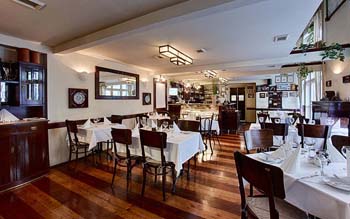 white-clothed tables inside Bouchon