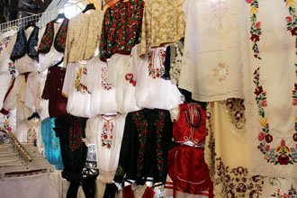 Embroidered folk textiles on the upper level of the Central market