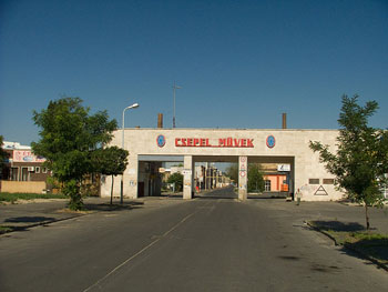 the entrance to the Csepel Industrial Compl. Csepel Művek written in red block letters