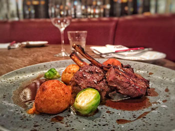 venison chops with Brussels sprouts, butternut squash puree, potatoo fritters