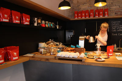 the barista lady making coffee with Hario