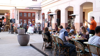 people on the terrace of a restaurant in Gozsdu Court