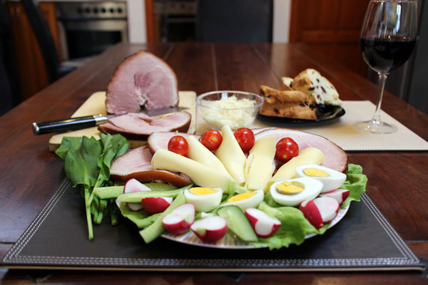 Hungarian Easter ham plate: ham slices, boiled egg, radish, lettuce