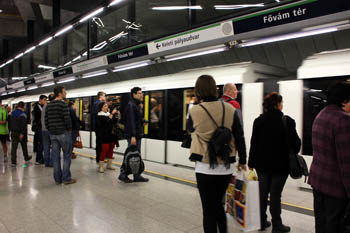 travellers at the Keleti train station getting in the metro cars