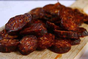 mangalica sausage slices on a wooden board