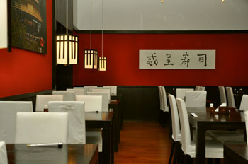 the red and black interior of Planet Sushi Oktogon