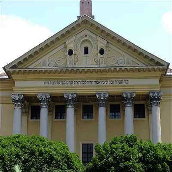 yellow colonaded synagogue building