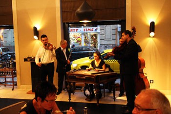 a folk band playing in ARAZ, a young lady playing the hammered dulcimer