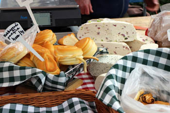 various cheeses on a green-white checkered cloth