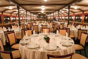 festively laid round tables onboard the ship