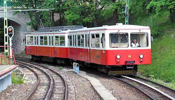 a red and white cogwheel tram