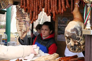 mangalica sausages and ham in a wooden booth on the Mangalica Festival