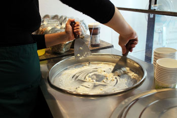 mixing the yogurt with fruits and choc chips