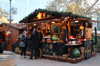 wooden stalls offering mulled wine and food-Vorosmarty sqr