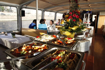 tourists having buffet lunch on a boat