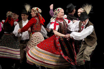 members of the Hungarian State Folk Ensemble dancing in traditional costume