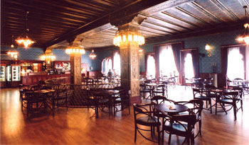 wood paneled interior of the cafe with the lights on
