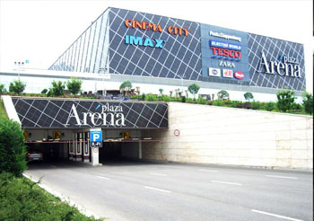 the facade of Arena Plaza with names of some shops on it