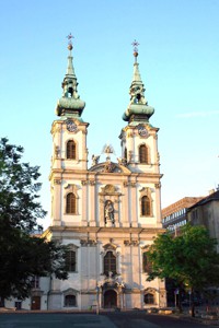 front view of the two-towered church on a summer day