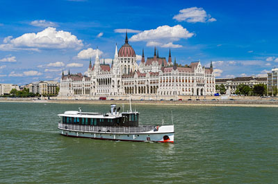 a white sightseeing ship plying the Danube