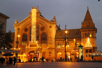 the Great Market Hall's facade illuminated at night