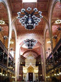 the richly decorated ceiling and the chandelier