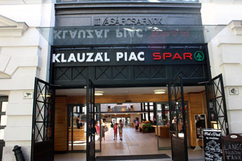 the entrance to the market with a Spar logo