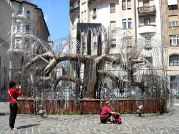 the metal willow Tree of Life, with 2 visitors next to it