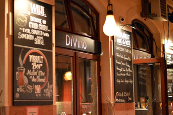 the entrance of the bar with chalk boards on the two sides of the door