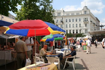 exhibitors under colourful shade umbrellas at the bookweek on Vorosmarty sqr.