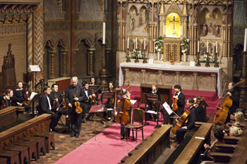 an orchestra playing at the main altar