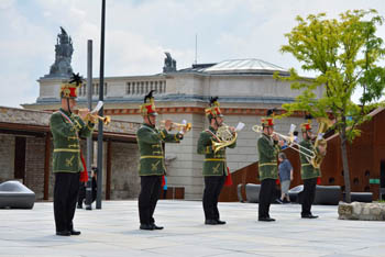 brass band in green and red hussar uniform
