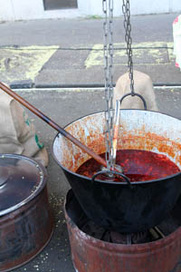 goulash in a large metal kettele over open fire