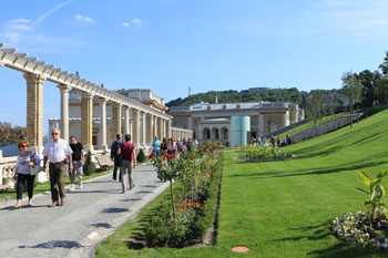 a colonnaded walkway and a park on street of hungarian flavours