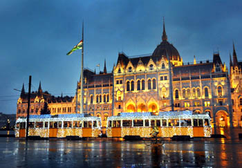 the light tram in front of the Parliament at the blue hour