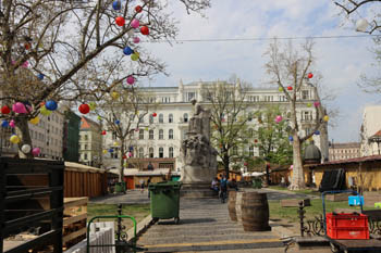 the square in spring time with the marble statue of M. Vorosmarty 