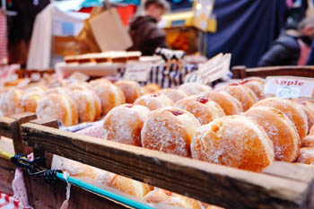 rows of traditional donuts at a festival