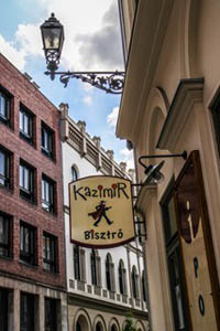 the logo of the Kazimir bistro hanging above the entrance