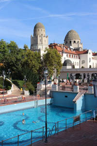 the Gellert Hotel's building and the oudoor pools on a clear summer day