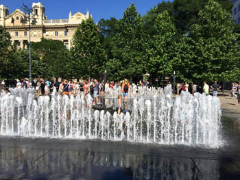 people listening to a concert at the interactive fountain, Szabadsag Sqr.