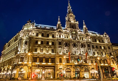 the New York Palace illuminated at night