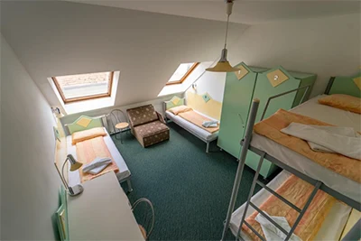 bunk bed and pale green lockers in the dorm