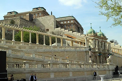 The restored stone walls, colonaded walkways and a two-towered palace with green dome of the Castle Bazaar