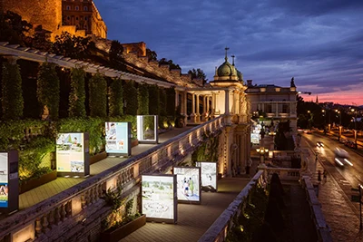 the palace buildings and promenades of the Castle Bazaar/Várkert bazár in Buda illuminated at night